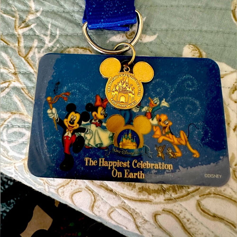 Walt Disney World lanyard and 6 collector pins.